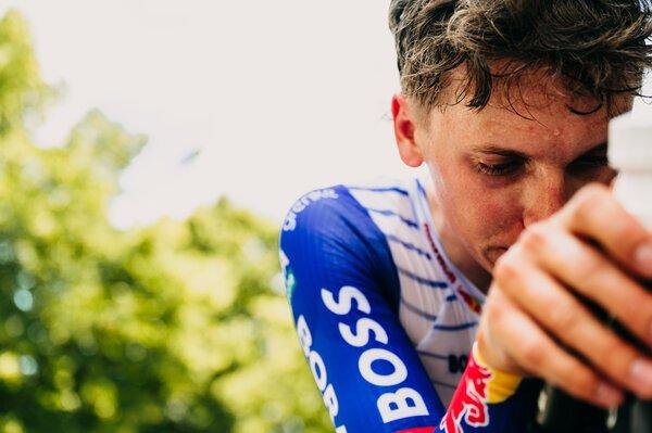 Gustave Blanc drinking from his bottle in the feed zone